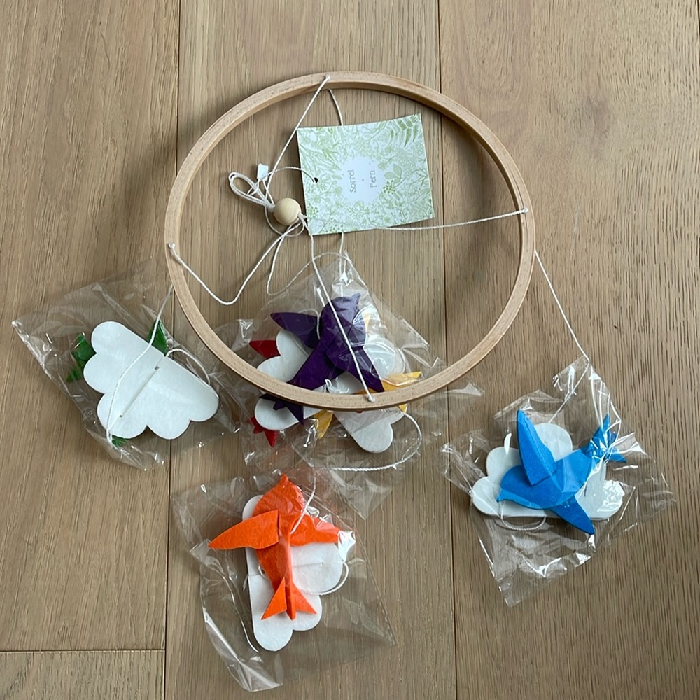 Sorrel and Fern baby crib mobile, rainbow birds and clouds.